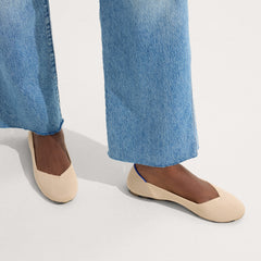 hover | The Flat round toe shoe in Ecru shown on-model at an angle.