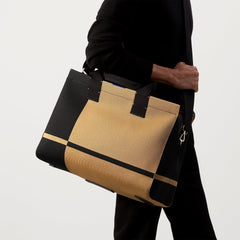 An alternate view of The Overnighter in Camel and Black on a model.