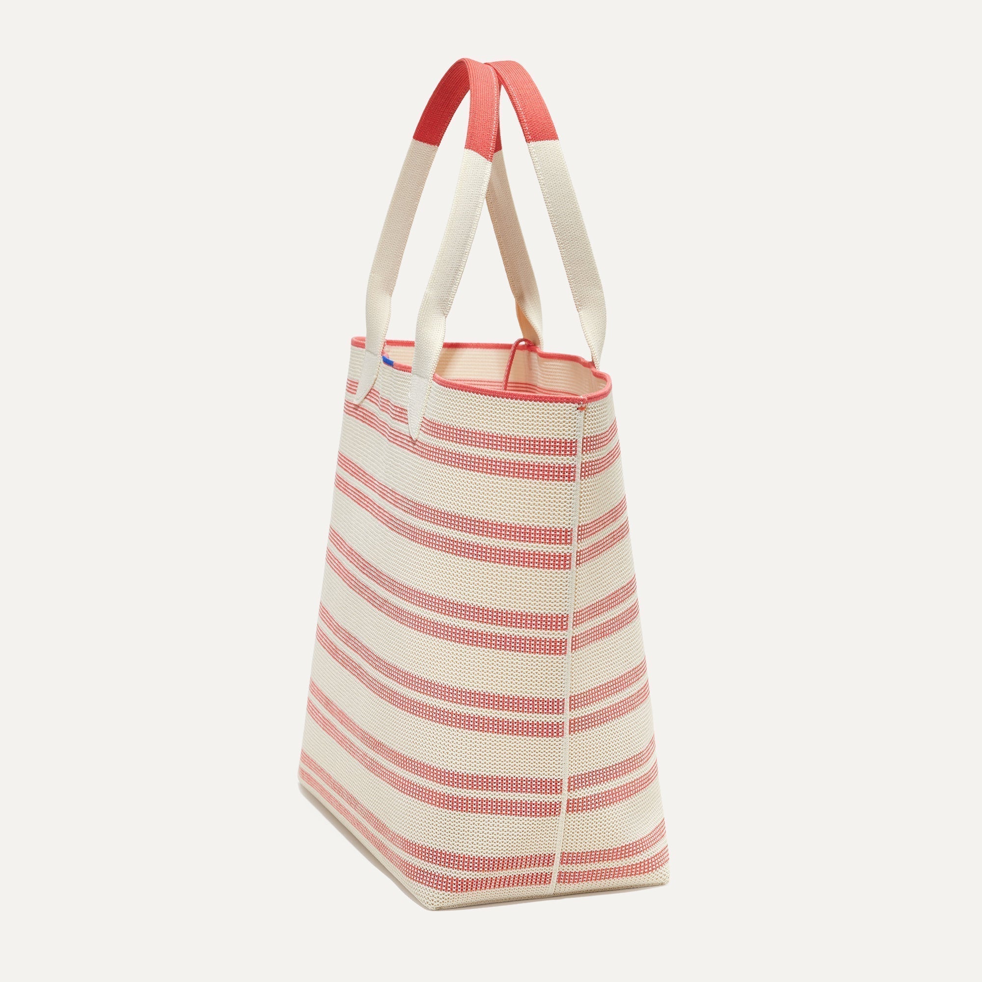 The Lightweight Tote in Coral Stripe shown in diagonal view.
