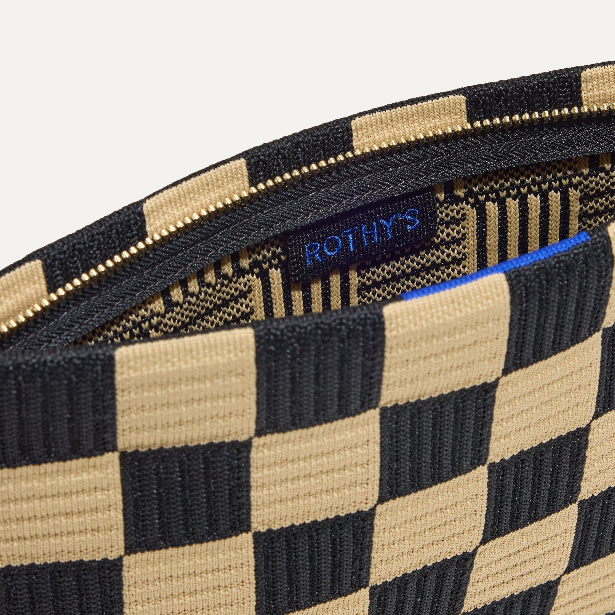 The Wristlet in Checker Classic interior view with Rothy's halo detail.