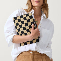 hover | Model holding The Wristlet in Checker Classic.