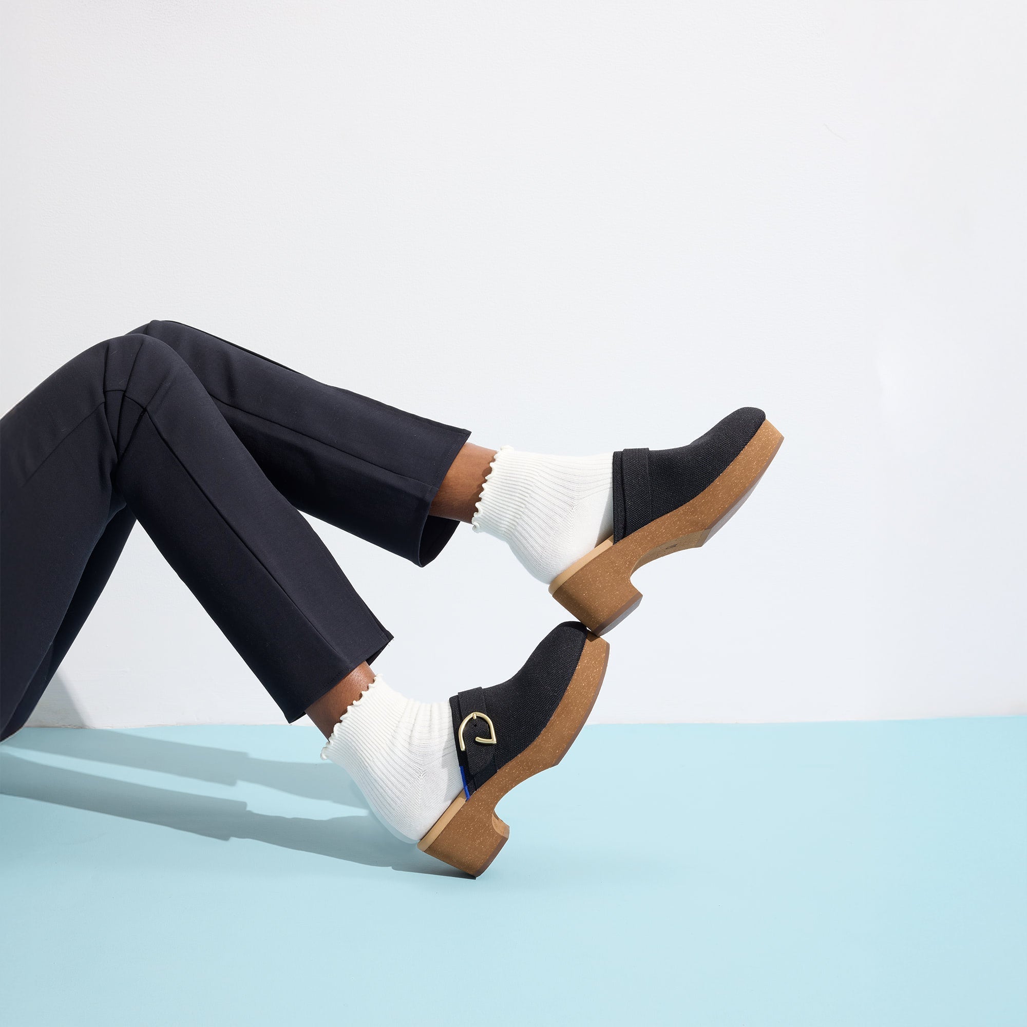 hover | Model wearing The Classic Clog in Black.