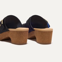 Close up of the heel of The Classic Clog in Black, with Rothy's signature blue halo. 