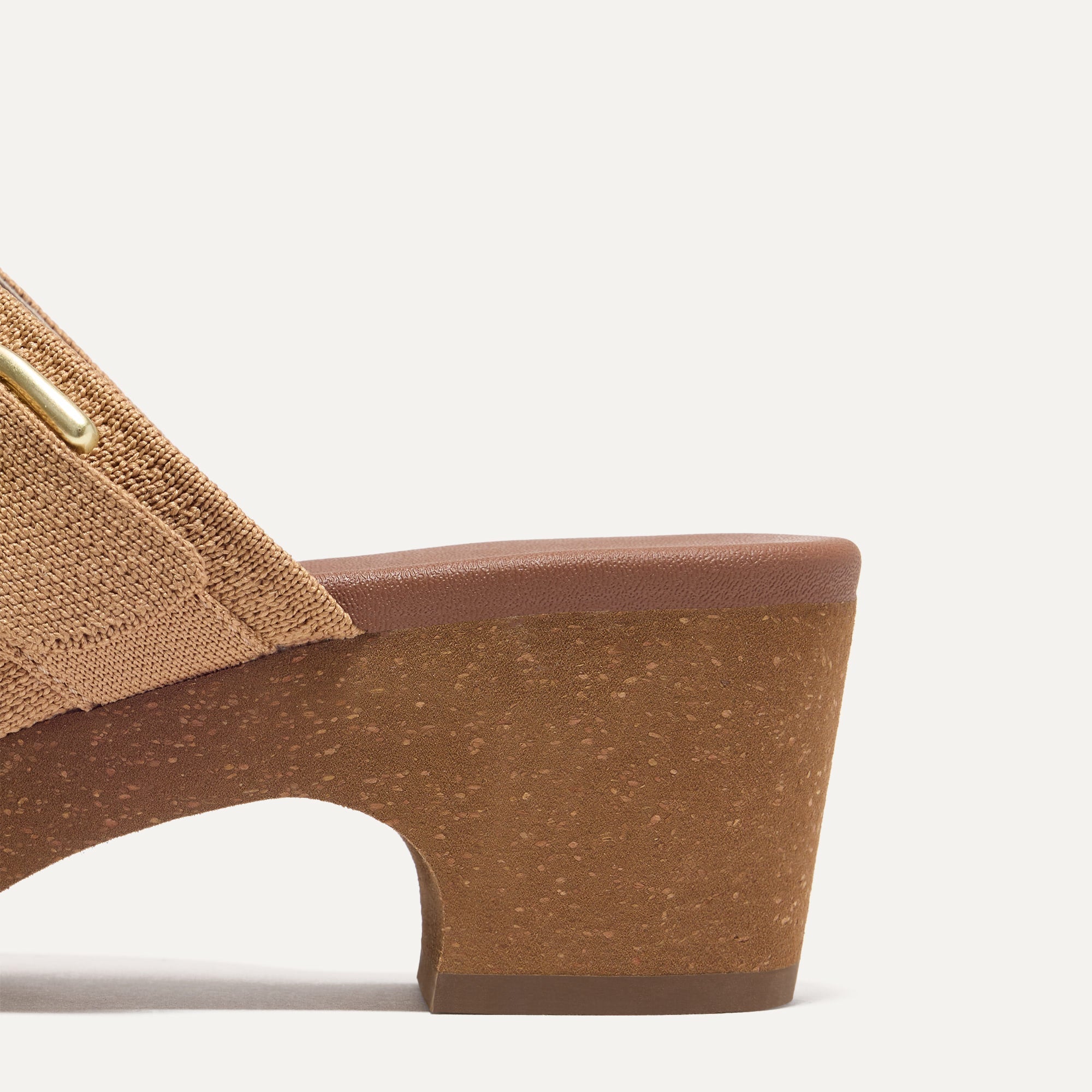 Close up of the heel of The Classic Clog in Butternut shown from the side.