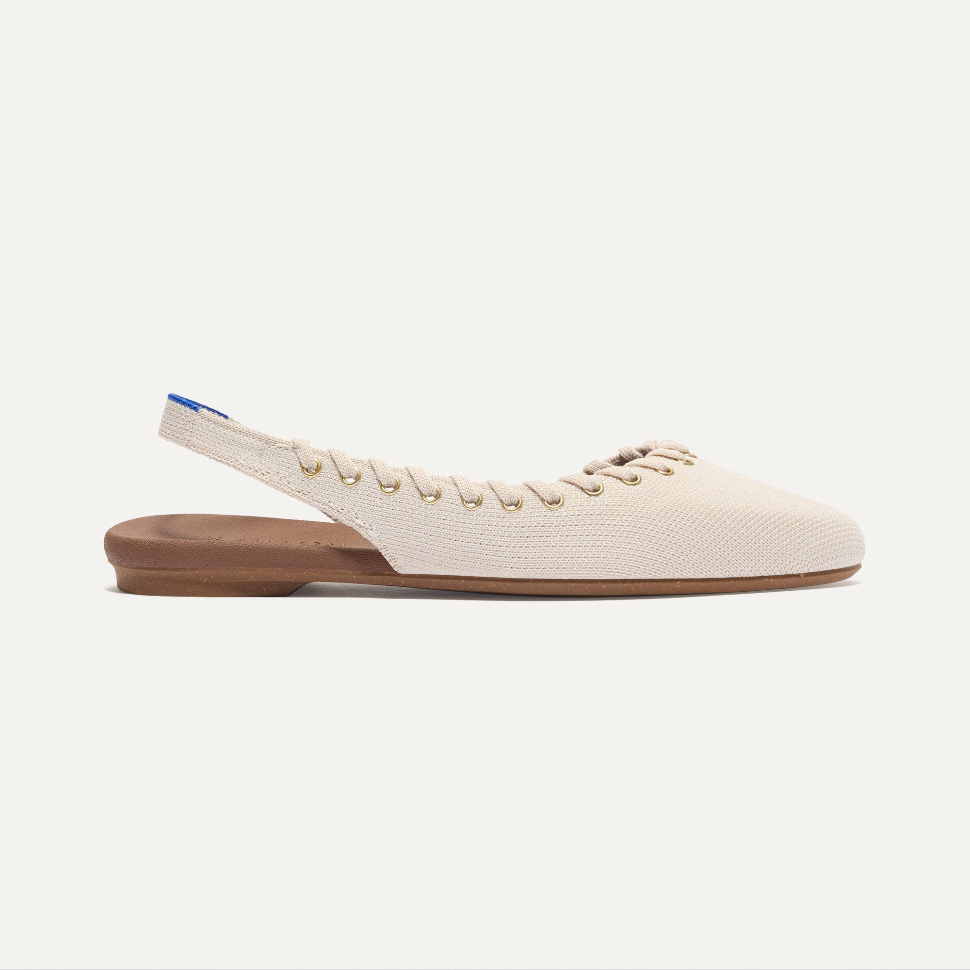 Side view of The Almond Slingback in Eyelet Ivory.