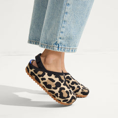 hover | A child wearing The Kids Clog in Desert Cat.