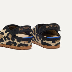 Close up of the heel of The Kids Clog in Desert Cat, with Rothy's signature blue halo. 