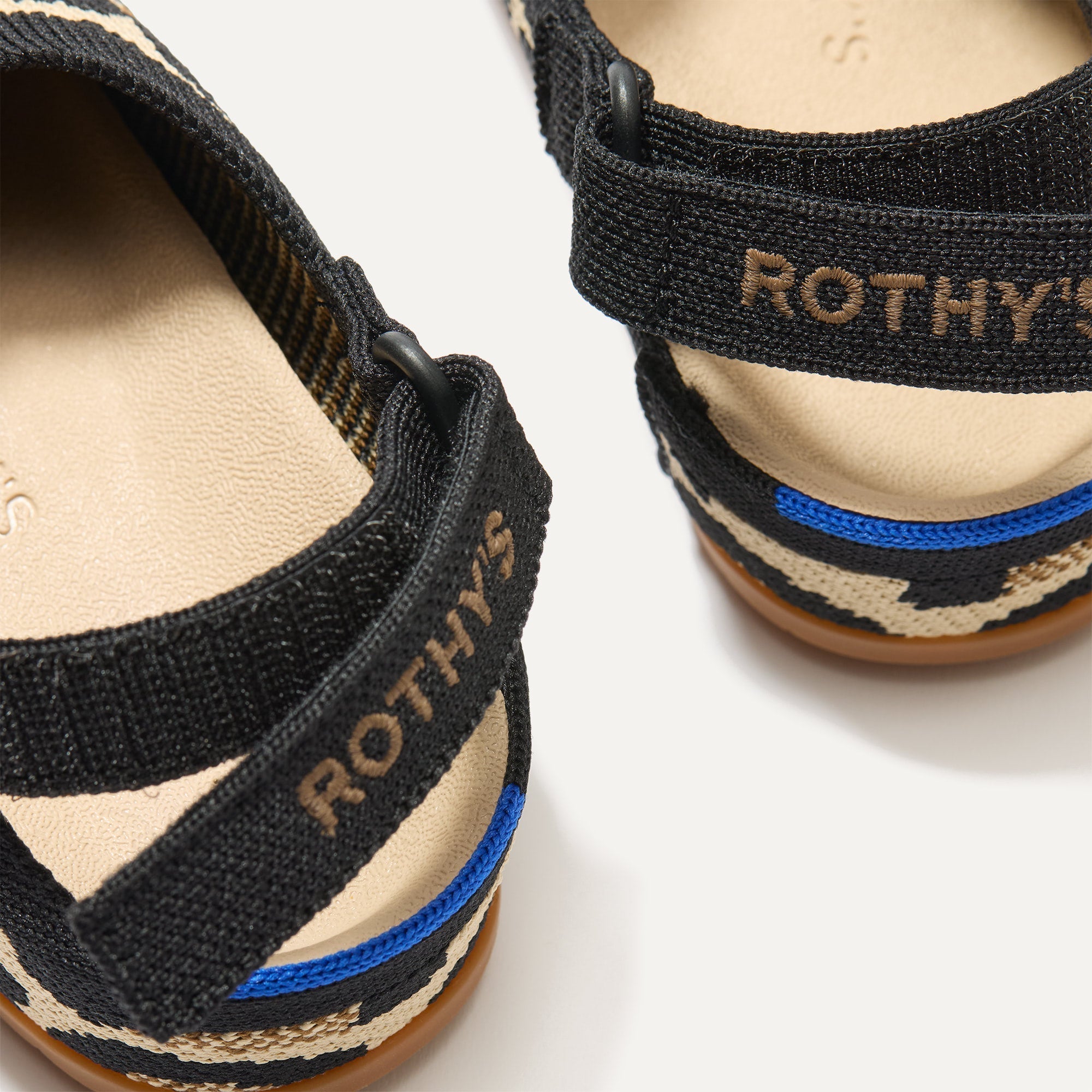 Close up of the back heel strap of The Kids Clog in Desert Cat.